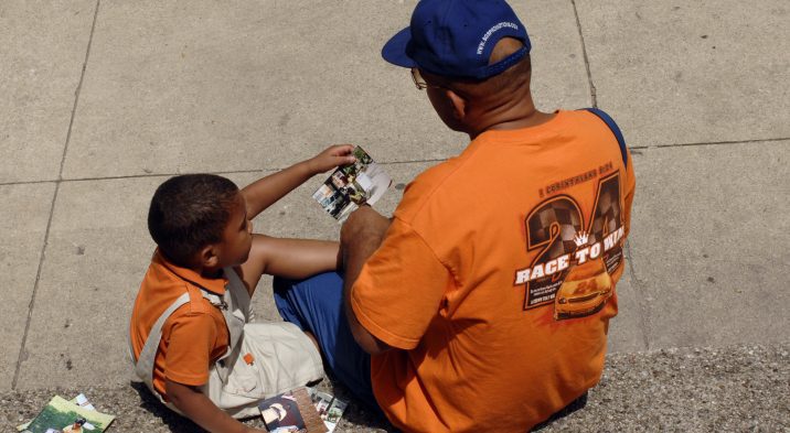 Father and Son Looking at Photos